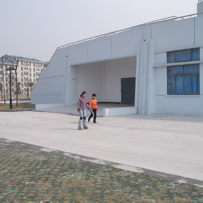 Family_Pics-010 On the road in front of the apartment gate. Guide Hanhan is skating and telling mother things about the campus.