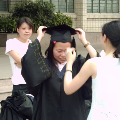 Hanhan_Graduation-011 Donning the cap and gown. Taken from the student behind her!