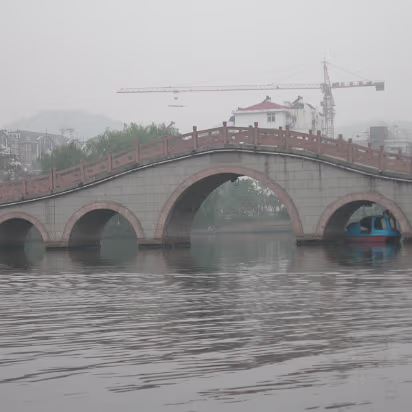 3_Horses_Nov_2005-008 Bridge with a marooned boat under it.