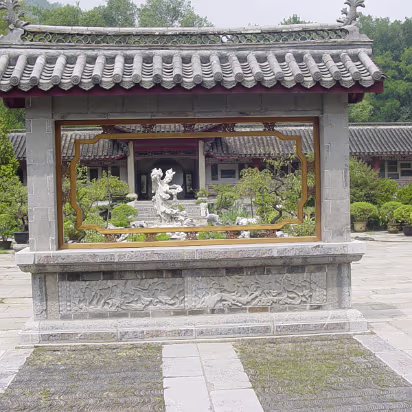 Caishi_Aug_2004-002 Inside a small garden that is walled by 300-400 year old stone carvings.