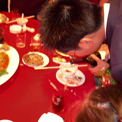 Rammy's_Wedding-018 Rammy has to balance a spoon on a chopstick, fill it with wine, then hold the spoon in his teeth to drink.