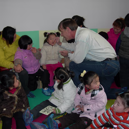 Kindergarden_2005-004 Trying to get this one off Mom's lap.