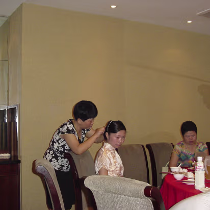 Wedding-Dinner-37 Hanhan's mom touches up her hair.
