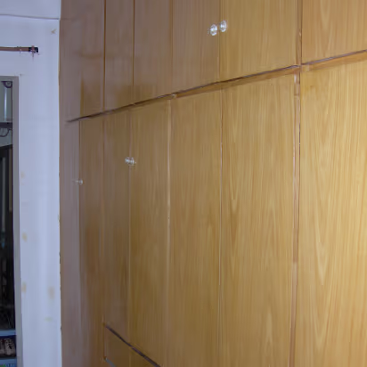 Guanghua-House-08 Looking down the hallway past the closets held shut with tape and wire.