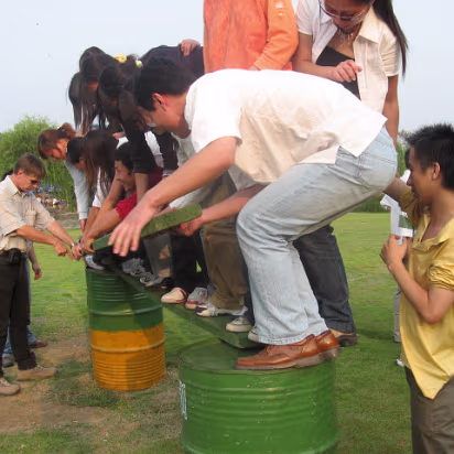 MidAutumnFest2006-18 Gary coaching on the placement of the board being moved by the team.