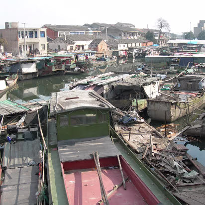 Moving-2006-01 We lived in a fishing village and these are some of the boats people live on.