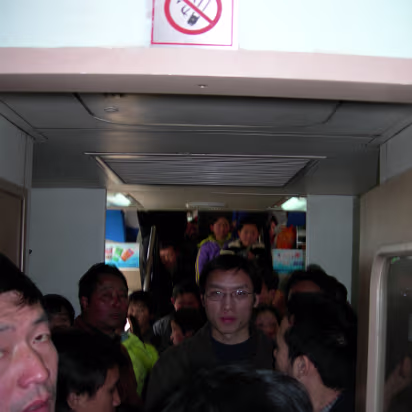 Moving-2006-03 At Spring Festival time, trains are standing room only. What a joy!