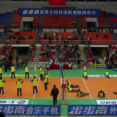 Volleyball-03 Teams are warming up, literally, it is not heated in the arena.