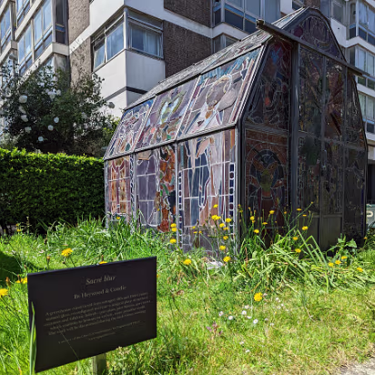 UK-2022-288 Greenhouse made from salvaged stained glass.