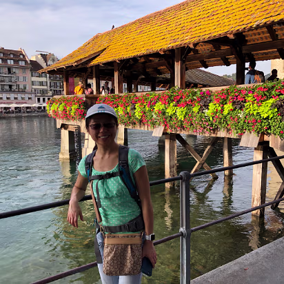 Switzerland-025 The setting sun brought the colors of the flowers to their best. Look at the outdoor seating across the river.