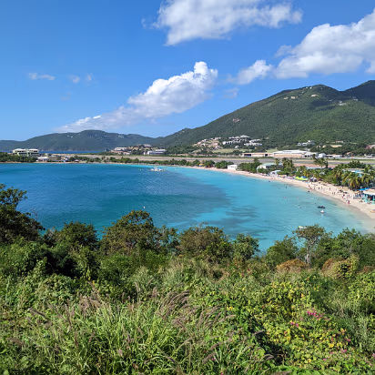 USVI-0017 The first beach we visited. We were both surprised at how blue the water is. Notice the airport directly behind the beach.