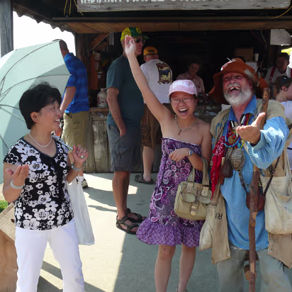 Indiana_State_Fair-009 Hanhan and her mom laugh at Johnny Appleseed's jokes.