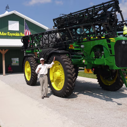 Indiana_State_Fair-010 Hanhan's dad with huge farm machinery.