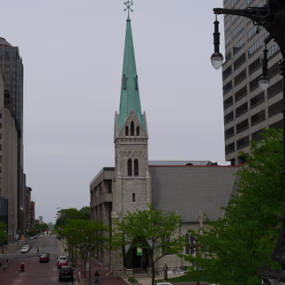 Indy_May_2009-011 An old church surrounded by tall buildings.