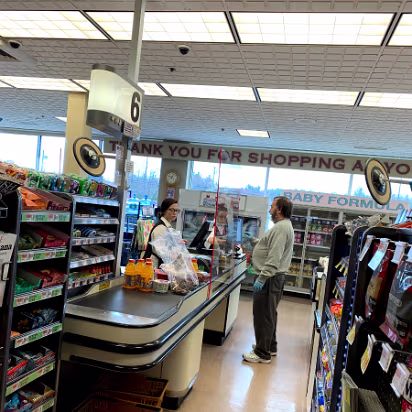 Covid-006 New checkout experience. Plexiglass barriers. Note no masks. Masks were not called for at the start.