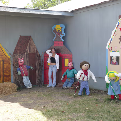 Apple_Orchard_Day-011 Hanhan helping the Three Little Pigs against the wolf.