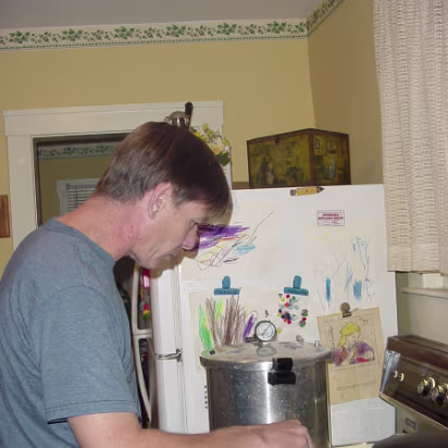 Family-011 Me, slaving away over a hot stove. I like to cook though.