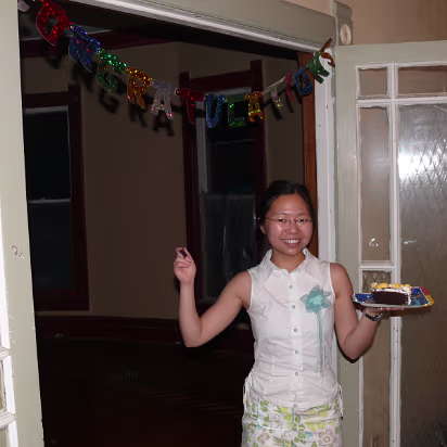 Hanhan_Graduation-035 Hanhan and her cake under the banner.