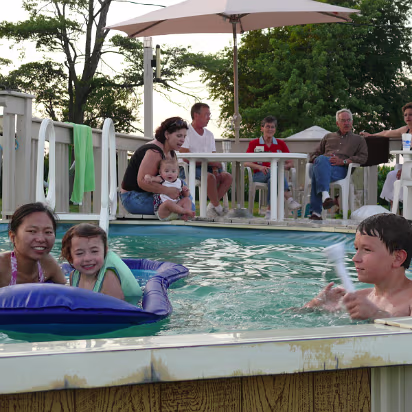 Independence_Day-020 Hanhan, Cassie, and Tré playing in the pool.