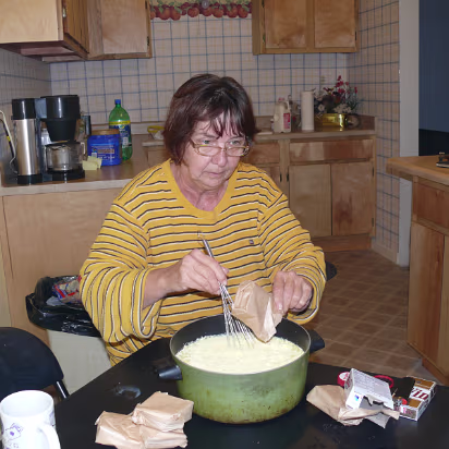 Thanksgiving_2007-002 Linda preparing the coconut cream pie filling.