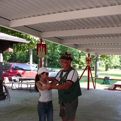 VolksFest_2007-016 Hanhan dancing a polka with a German in traditional costume.