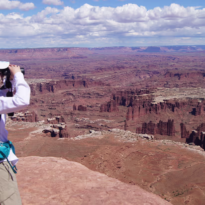 Canyonlands_NP-048 A grand view from here. Hanhan is looking at the 'Needles' disctric of the park.