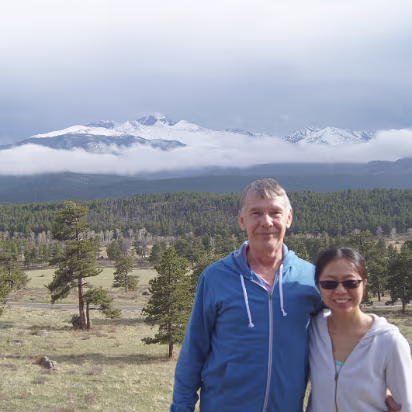 Rocky_Mountain_NP-023 Snowy mountains peaking from behind the clouds.
