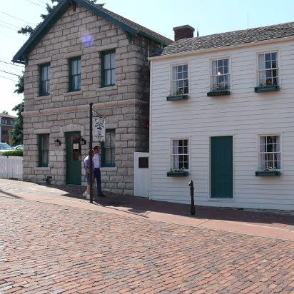 Hannibal-019 Ed & Jeff in front of Mark Twain's boyhood house.