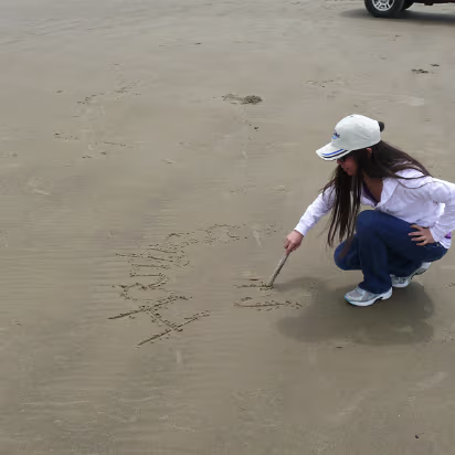 Ocean-026 A time honored tradition, writing your name in the sand.