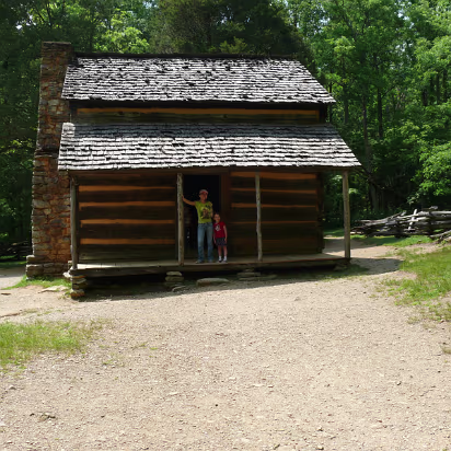 Tennessee-011 Hanhan & Cassie in front of the 1820 cabin. Small, isn't it?